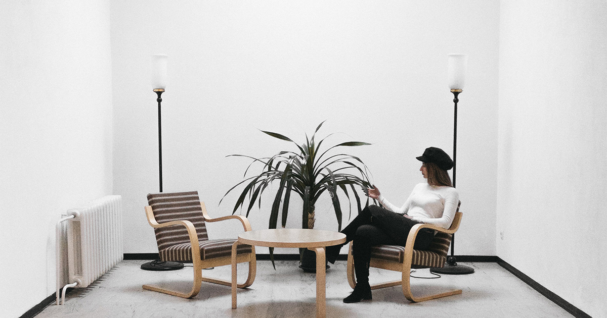 lady sitting in a white room